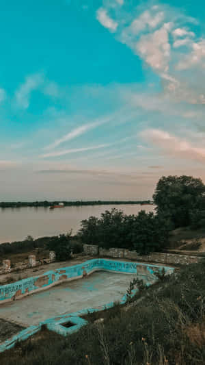 Abandoned Pool By The Lake Wallpaper