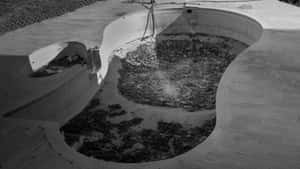 Abandoned Pool With Debris Wallpaper