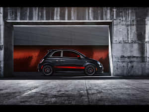 Abarth Sports Car Showcased In Landscape Setting Wallpaper