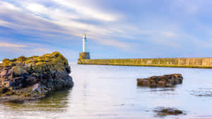 Aberdeen Harbour Lighthouseat Dusk Wallpaper