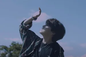 Abnormal Man Covering Face Wallpaper