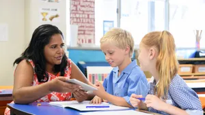 Aboriginal Teacher Talking To Students Wallpaper