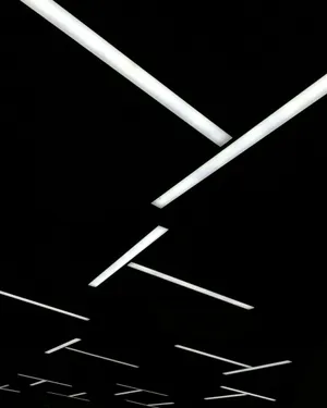 Abstract Fluorescent Lights Against Black Background Wallpaper