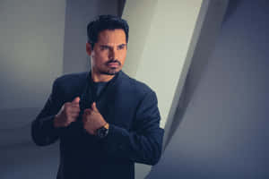 Accomplished Actor Michael Peña In Pensive Mood Wallpaper