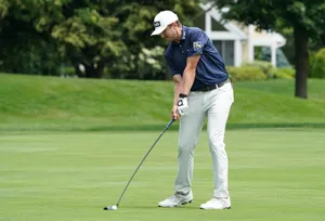 Ace Golfer Mackenzie Hughes In Action Wallpaper