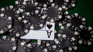 Aceof Spades Among Casino Chips Wallpaper