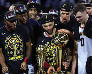 Achieving Glory: Nba Champions Celebrating Victory Wallpaper