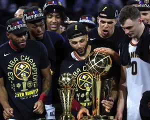 Achieving Glory: Nba Champions Celebrating Victory Wallpaper