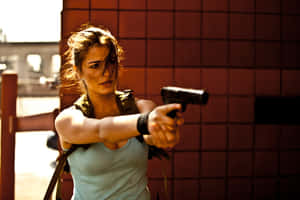 Action Heroine Firing Pistol Wallpaper