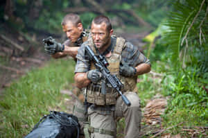 Action Scenein Jungle Sullivan Stapleton Wallpaper