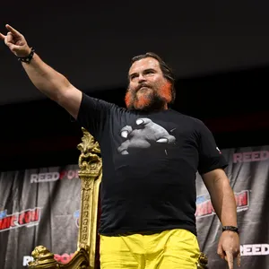 Actor Jack Black Looks Sharp In A Classic White T-shirt And Black Leather Jacket Wallpaper