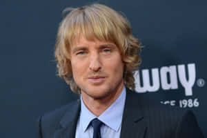 Actor Owen Wilson Poses For A Photo Wallpaper