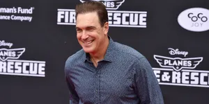 Actor Patrick Warburton Striking An Animated Pose Wallpaper