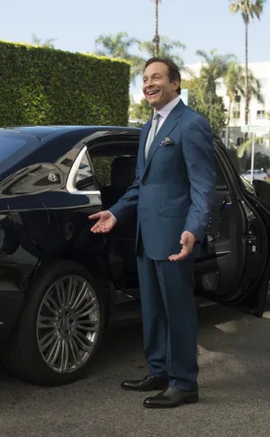 Actor Steve Guttenberg Smiling On Set Wallpaper