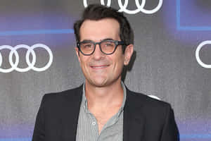 Actor Ty Burrell Smiling At An Event Wallpaper