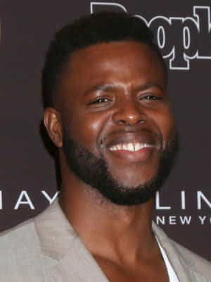 Actor Winston Duke Taking A Break On Set. Wallpaper