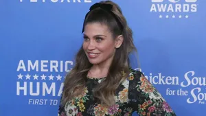 Actress Danielle Fishel Striking A Pose Wallpaper