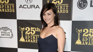 Actress Danielle Harris Posing In An Elegant Outfit Wallpaper