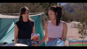 Actress Ellen Wong Striking A Captivating Pose In A Elegant Red And White Outfit Wallpaper