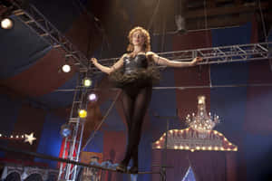 Actress Izabella Miko Striking A Pose During A Photoshoot Wallpaper