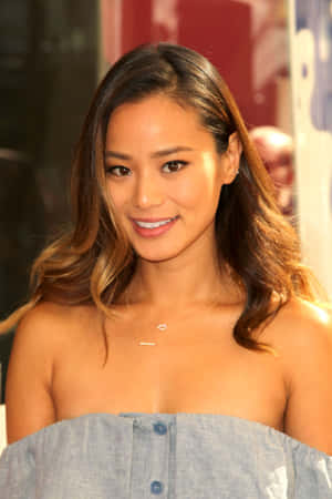 Actress Jamie Chung Posing For A Portrait Wallpaper