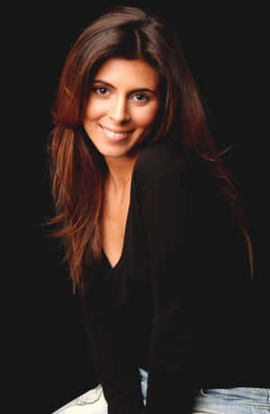 Actress Jamie Lynn Sigler Posing Elegantly In A Stunning Outfit. Wallpaper