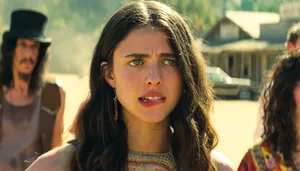 Actress Margaret Qualley Posing For A Photoshoot. Wallpaper