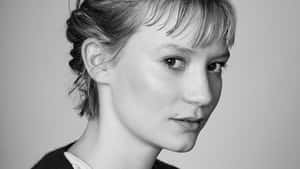 Actress Mia Wasikowska Posing For The Camera Wallpaper