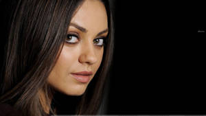 Actress Mila Kunis In Black Wallpaper