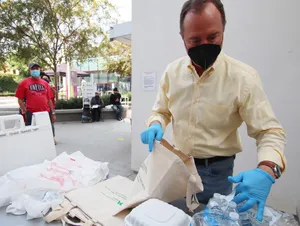 Adam Schiff Packing Covid-19 Relief Goods Wallpaper