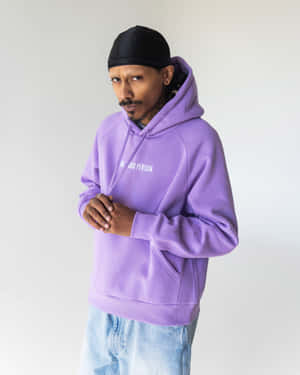 Add A Hint Of Cool To Your Look With This Stylish Purple Sweatshirt. Wallpaper