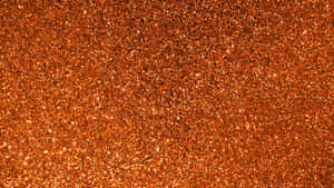 Add A Luxurious Sparkle To Your Space With Orange Glitter Wallpaper