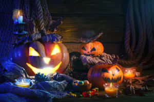 Add A Spooky Glow To Your Halloween Festivities With These Candle Decorations! Wallpaper