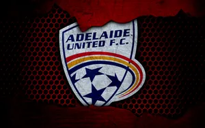 Adelaide United Players Celebrate On The Field Wallpaper