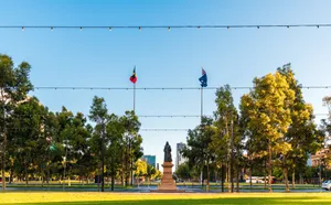 Adelaide Victoria Square Statueand Flags Wallpaper