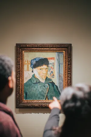 Admiring Paintings At Van Gogh Museum Wallpaper