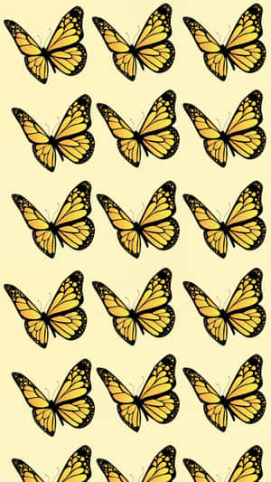 Admiring The Beauty Of A Flock Of Cute Yellow Butterflies Wallpaper