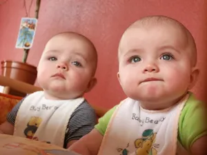 Adorable Baby Smiling In A Hat Wallpaper