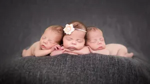 Adorable Baby Wearing White Knitted Hat Wallpaper