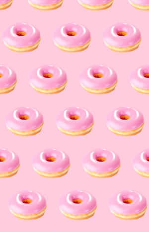 Adorable Donut With Sprinkles And Pink Icing Wallpaper