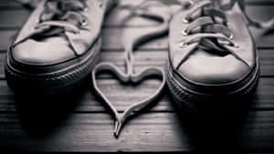 Adorable Pink And White Sneakers With Heart Designs Wallpaper