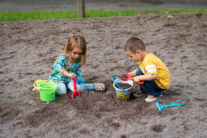 Adorable Toddler Playing In The Park Wallpaper