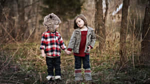 Adorable Toddler Smiling In Nature Wallpaper