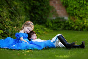 Adorable Toddlers Smiling And Having Fun At The Playground Wallpaper