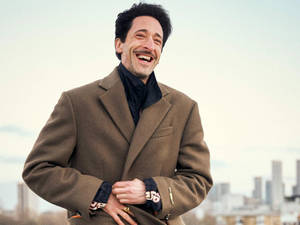 Adrien Brody In Brown Coat Wallpaper