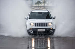 Adventure-ready Jeep Renegade On Scenic Off-road Terrain Wallpaper