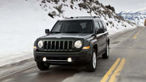 Adventurous Jeep Patriot Off-roading Wallpaper