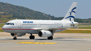 Aegean Airlines Flag Carrier Airbus A319 Near Mountain Wallpaper