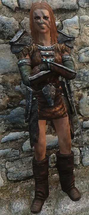 Aela The Huntress Standing Confidently In The Wildlands Of Skyrim Wallpaper