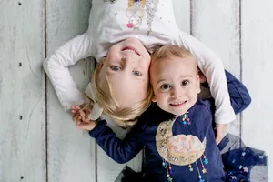 Aerial Photography Of Boy And His Cute Sister Wallpaper